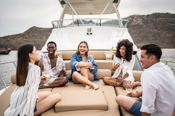 istock Happy friends talking during a yacht trip 1481251738