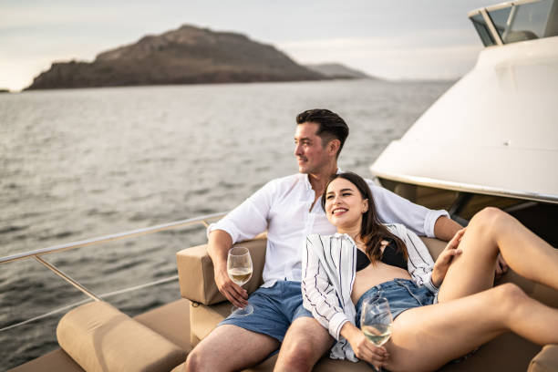 istock Young couple embracing and relaxing on a yacht 1481251740