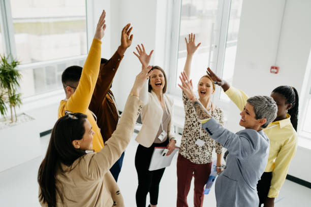 istock Colleagues hug each other at work after success 1481252362