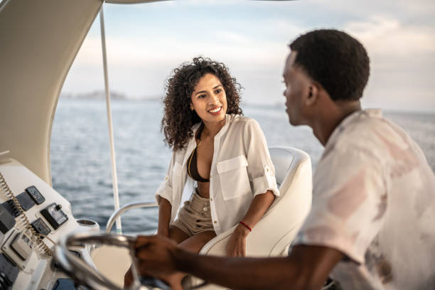 istock Young couple talking during a yacht trip 1481252850