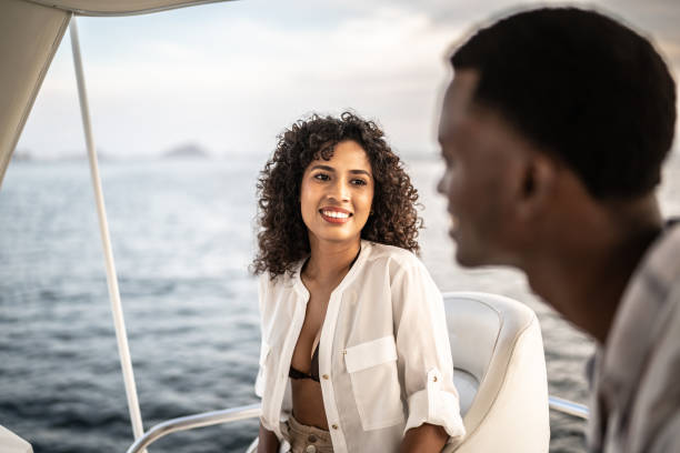 istock Young couple talking during a yacht trip 1481252872
