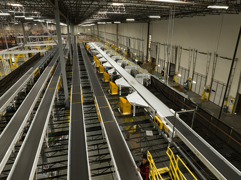 An aerial view of the conveyor belts inside a fulfillment center.
