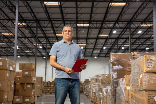 istock Middle Eastern Man With Clipboard In a Fulfillment Center Looking At Camera 1481252993