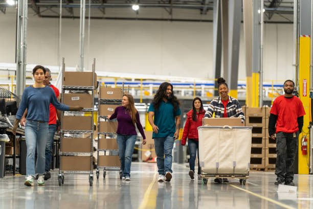 istock Diverse Group Of Workers Walking Towards Camera In a Fulfillment Center 1481253032