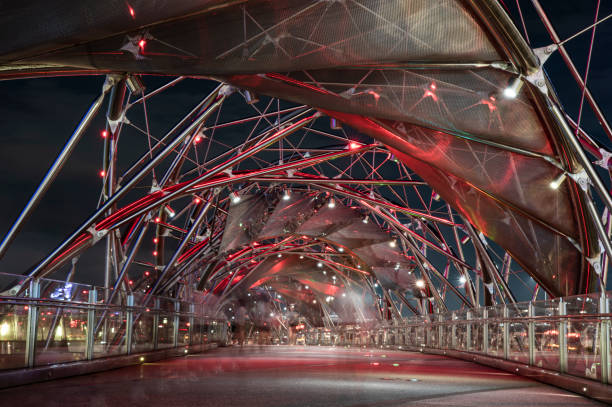 istock Modern steel bridge with red lights at night 1481254434