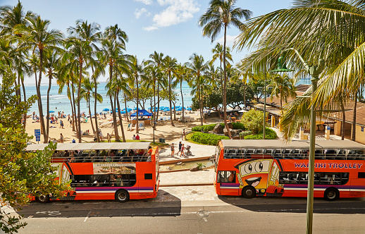 Waikiki, Oahu, Hawaii, USA, - February 6, 2023: View overlooking Kalakaua Ave in Waikiki where the Trolleys stop