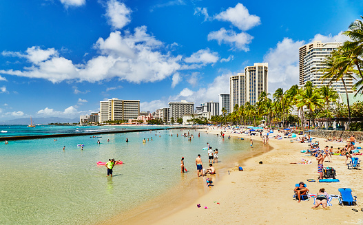 Waikiki, Oahu, Hawaii, USA, - February 6, 2023: Tourists on Waikiki Beach
