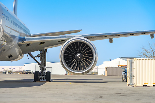 Victorville, CA, USA – March 25, 2023: Front view of a jet turbine engine on a commercial airline plane on the ground at Southern California Logistics Airport in Victorville, California.