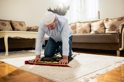 Muslim man making traditional prayer