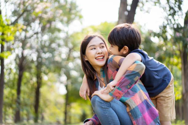 istock Mother and son playing together at the park. 1481266124