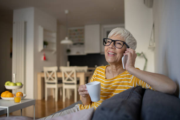 istock Happy senior woman using mobile phone 1481267359