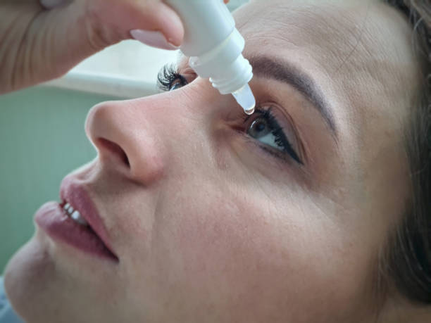 istock Woman dripping into her eyes with antibacterial drops closeup 1481267524