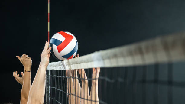 istock Volleyball players arms hitting ball side view 1481267546