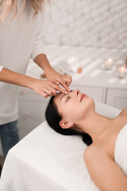 istock Young woman doing massage to client in salon 1481267673
