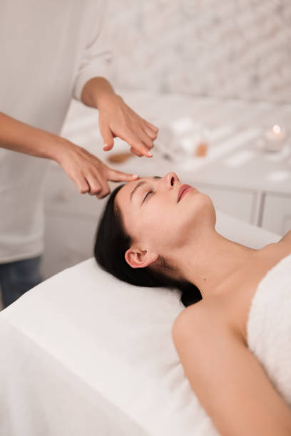 istock Crop female therapist doing acupressure face massage to client 1481267674
