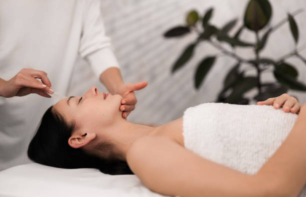 istock Crop beautician doing gua sha massage to woman 1481267695