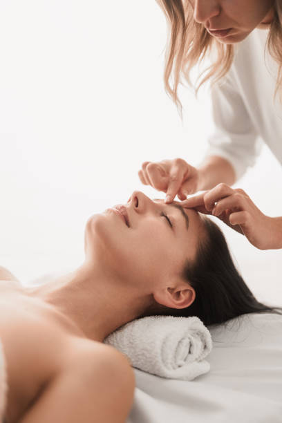 istock Crop masseuse massaging face of client in spa salon 1481267721