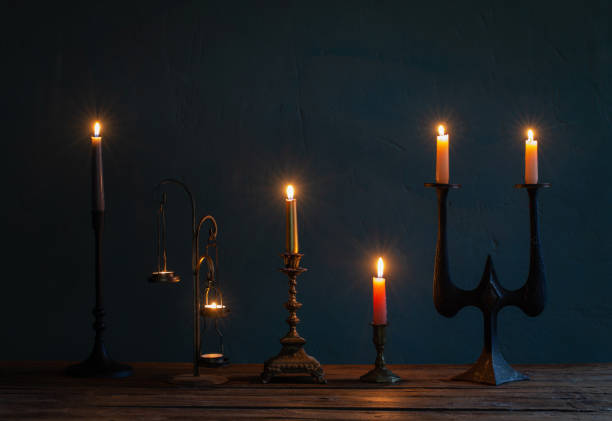 istock burning candles in vintage candlesticks on dark background 1481267869