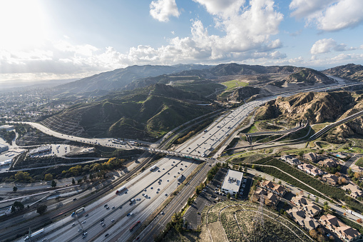 Aerial view of the Golden State 5 freeway at Balboa Blvd near the Newhall Pass at the edge of Los Angeles, California.