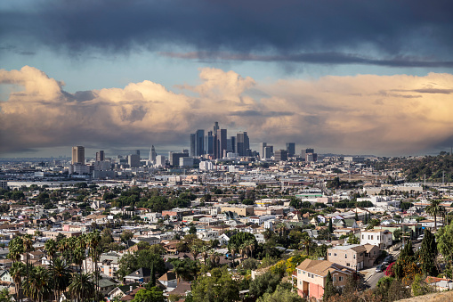Hilltop view of downtown Los Angeles California with storm clouds.