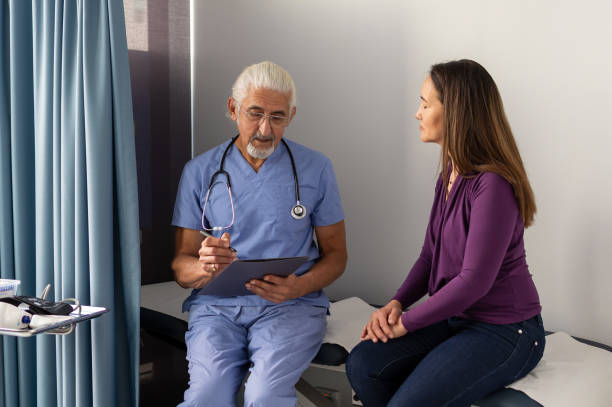 istock Male general practitioner with female middle age patient 1481275206