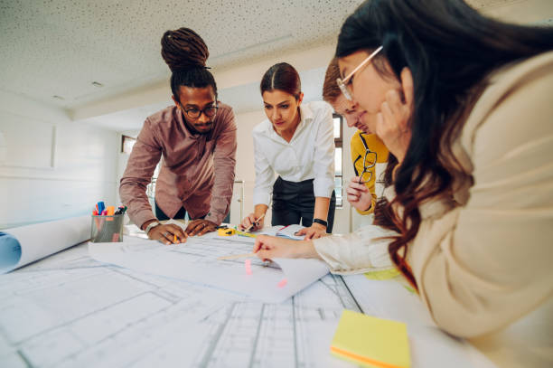 istock Diverse group of engineers or architects having a meeting in an office 1481276928
