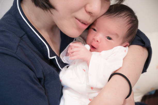 istock cute japanese baby with mother 1481279193