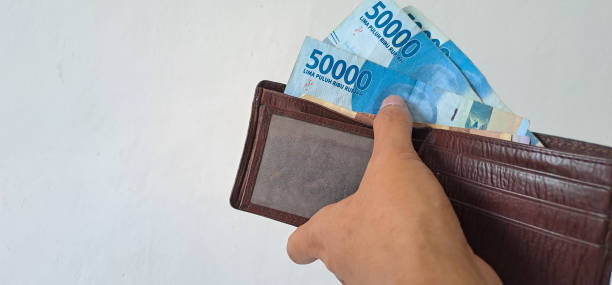 istock hands take rupiah money from wallet isolated on white background 1481284802
