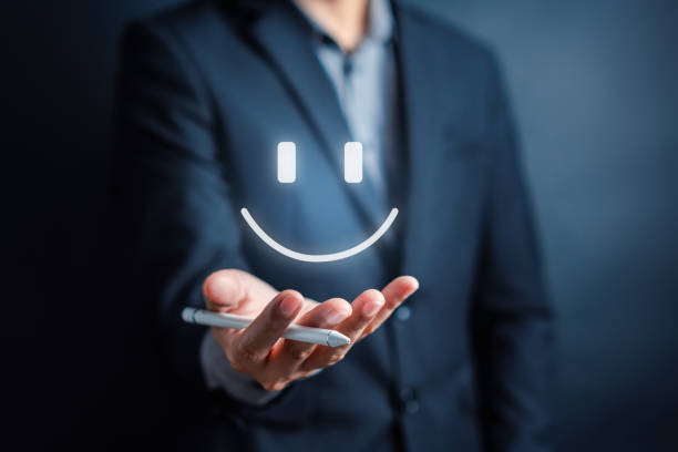 Customer Satisfaction Survey, Businessman holding Smile icon satisfaction, service experience rating online application, customer evaluation product service quality, satisfaction feedback review.