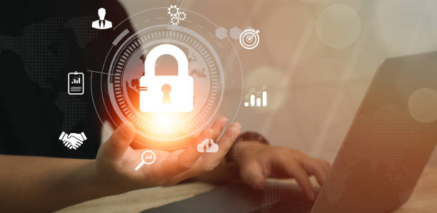 istock Technology and business. Businessman using computer laptop and smartphone to connecting and privacy locked blurred blue and dark background. 1481289188