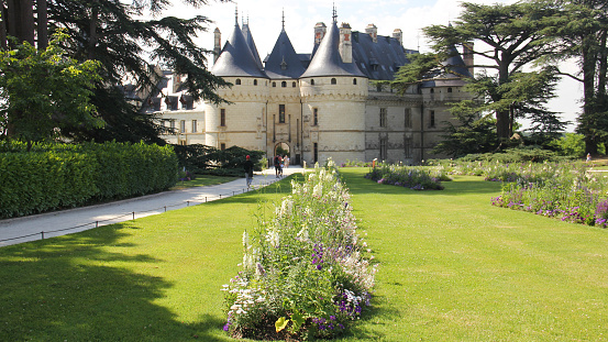 Chateau de Chaumont, green lawn with flowerbeds on approach to the main gate in the foreground, Loire Valley, France
