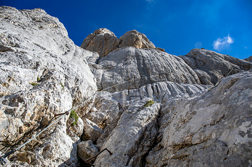 Young man sport climbing on natural rock on mountain Visocica - Bosnia and Herzegovina