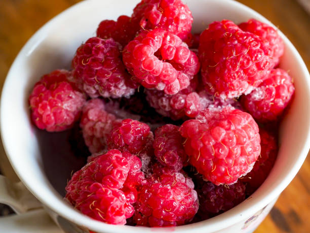 Fresh frozen raspberry inside container