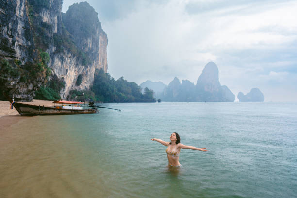 istock Cheerful woman on Railey beach in Krabi 1481298350