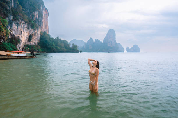 istock Cheerful woman on Railey beach in Krabi 1481299038