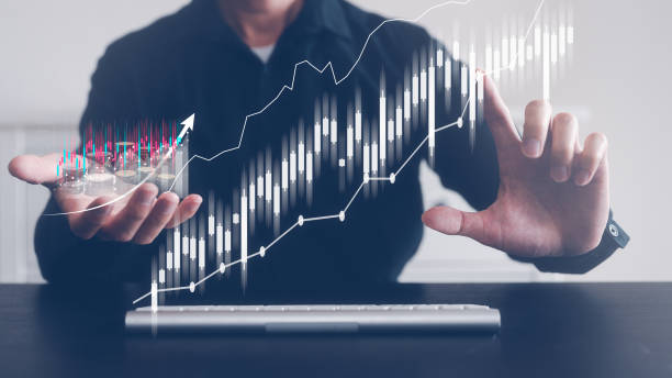 istock investment financial strategy concept, man  working on keyboard virtual trading graph 1481299247