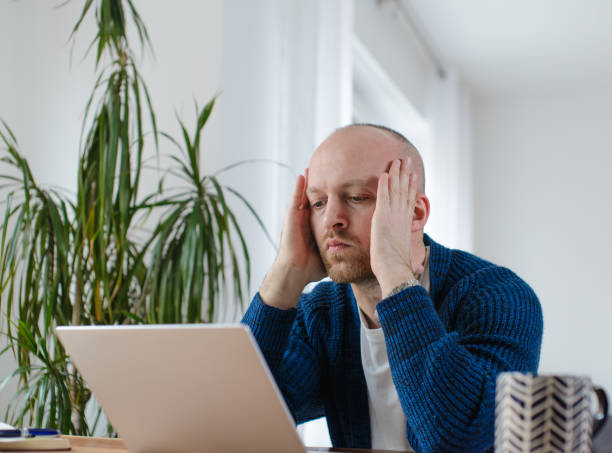 istock A man under stress looks at his laptop 1481300155