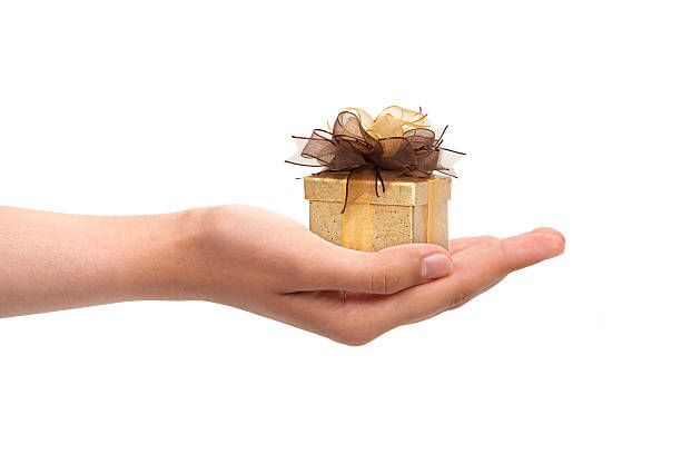 istock Yellow gift box in girl's hand 148130050