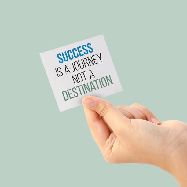 istock hand holding a white note paper with a phrase about success 1481300899