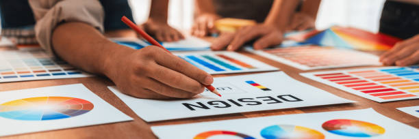 istock Graphic designer brainstorming logo and graphic arts at workshop. Scrutinize 1481304043