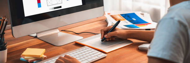 istock Graphic designer works on computer laptop with digital pen. Scrutinize 1481304685