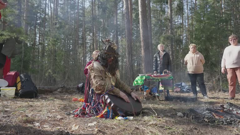 Shaman and ritual participants meditate after the ceremony.