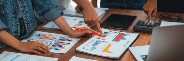 istock Analyst team utilizing BI Fintech to analyze financial dashboard. Scrutinize 1481305453