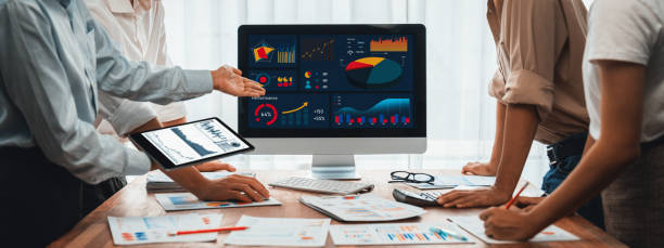 istock Analyst team utilizing BI Fintech to analyze with tablet. Scrutinize 1481305594