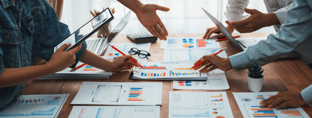 istock Analyst team utilizing BI Fintech to analyze financial dashboard. Scrutinize 1481305857