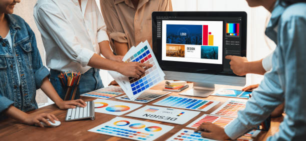istock Graphic designer brainstorming logo and graphic arts at workshop. Scrutinize 1481307031