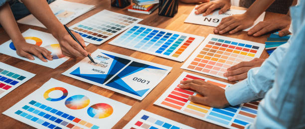 istock Graphic designer brainstorming logo and graphic arts at workshop. Scrutinize 1481307054