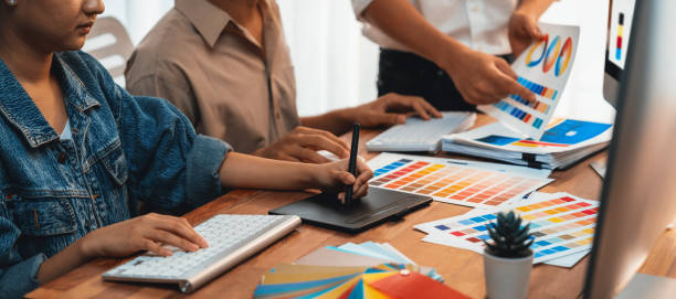 istock Graphic designer works on computer laptop with digital pen. Scrutinize 1481307298