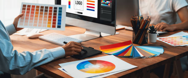 istock Graphic designer works on computer laptop with digital pen. Scrutinize 1481307363