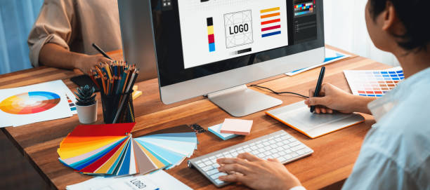 istock Graphic designer works on computer laptop with digital pen. Scrutinize 1481308335